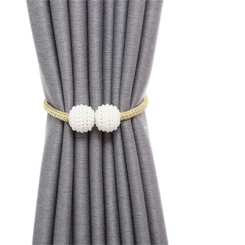 Conjunto de 2 prendedores de cortina magnéticos estilo boho chic com detalhes em pérola artificial.