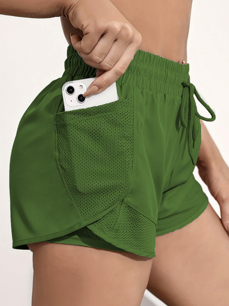 Shorts de ioga femininos de secagem rápida com bolso de tela.