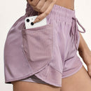 Shorts de ioga femininos de secagem rápida com bolso de tela.