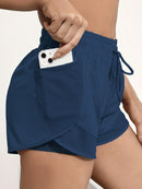 Shorts de ioga femininos de secagem rápida com bolso de tela.