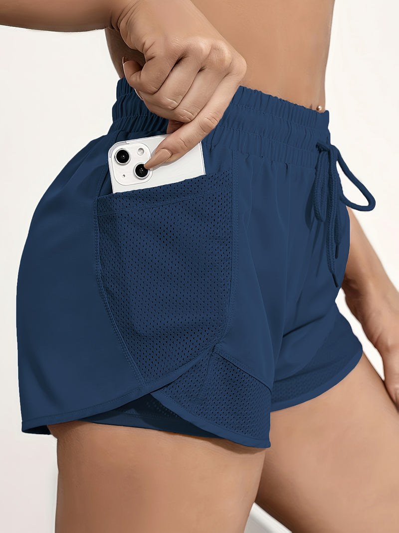 Shorts de ioga femininos de secagem rápida com bolso de tela.