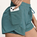 Shorts de ioga femininos de secagem rápida com bolso de tela.