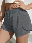 Shorts de ioga femininos de secagem rápida com bolso de tela.