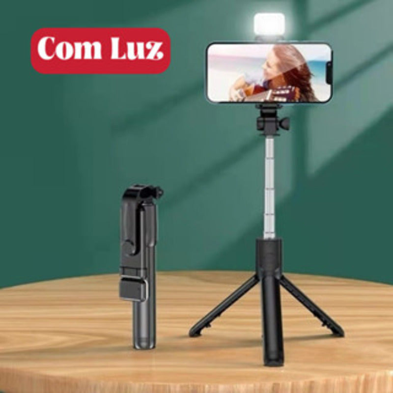Bastão de selfie com tripé e luz LED retrátil, com controle via Bluetooth para celular.