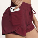 Shorts de ioga femininos de secagem rápida com bolso de tela.