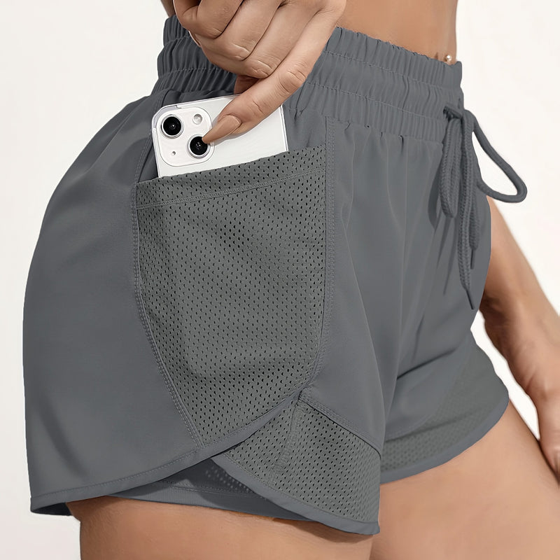 Shorts de ioga femininos de secagem rápida com bolso de tela.