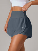 Shorts de ioga femininos de secagem rápida com bolso de tela.