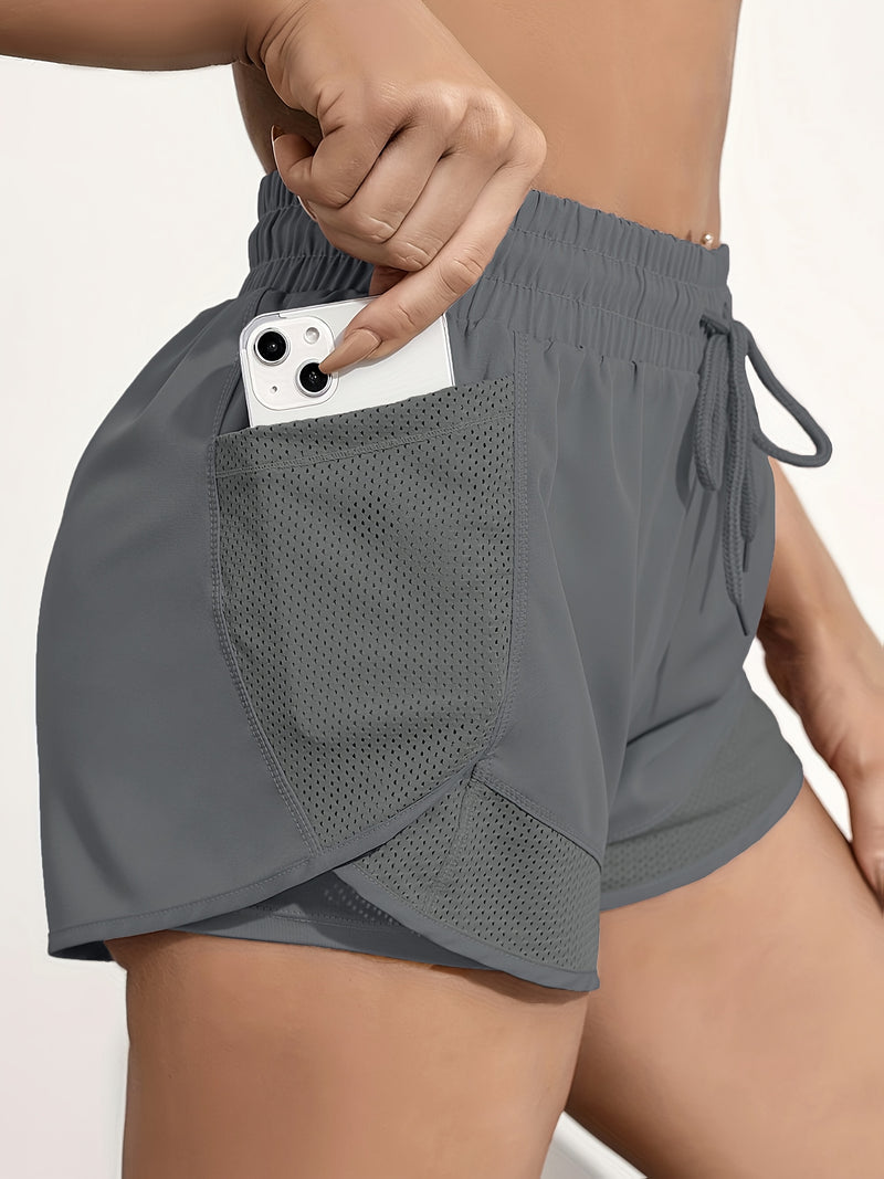 Shorts de ioga femininos de secagem rápida com bolso de tela.