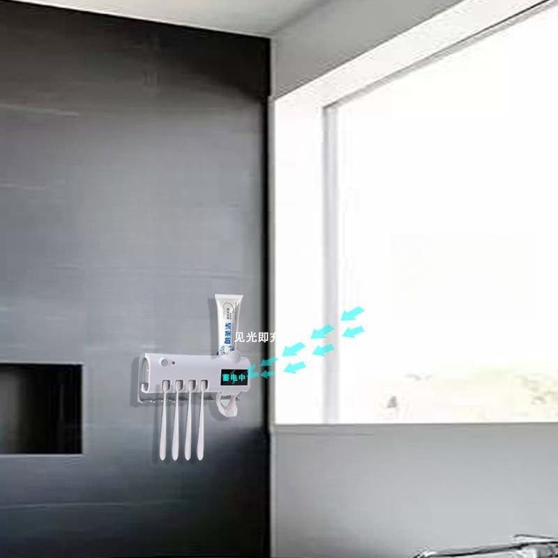 Suporte para escova de dentes elétrica com armazenamento integrado, sensor inteligente, esterilização, ventilação e drenagem eficiente.