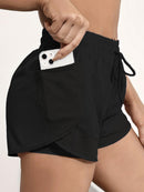 Shorts de ioga femininos de secagem rápida com bolso de tela.