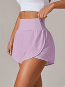 Shorts de ioga femininos de secagem rápida com bolso de tela.