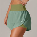 Shorts de ioga femininos de secagem rápida com bolso de tela.